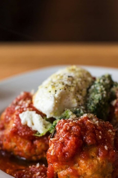 Meatballs always remind me of high school lunches. My mom used to make them the night before and put them on sandwiches, topped with iceberg lettuce and pickled eggplant. This recipe from my partner Michele uses equal parts veal and cheese. It’s a totally decadent version my teenage self would have loved!